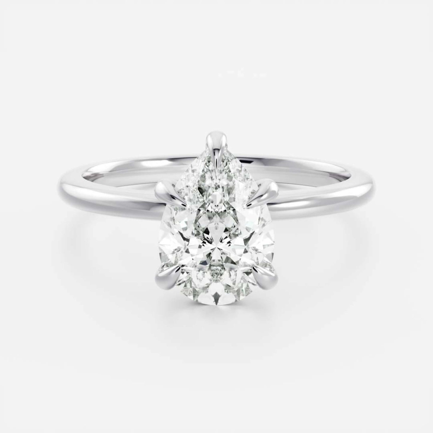 14k White Gold Pear Cut Diamond Basket Style Ring