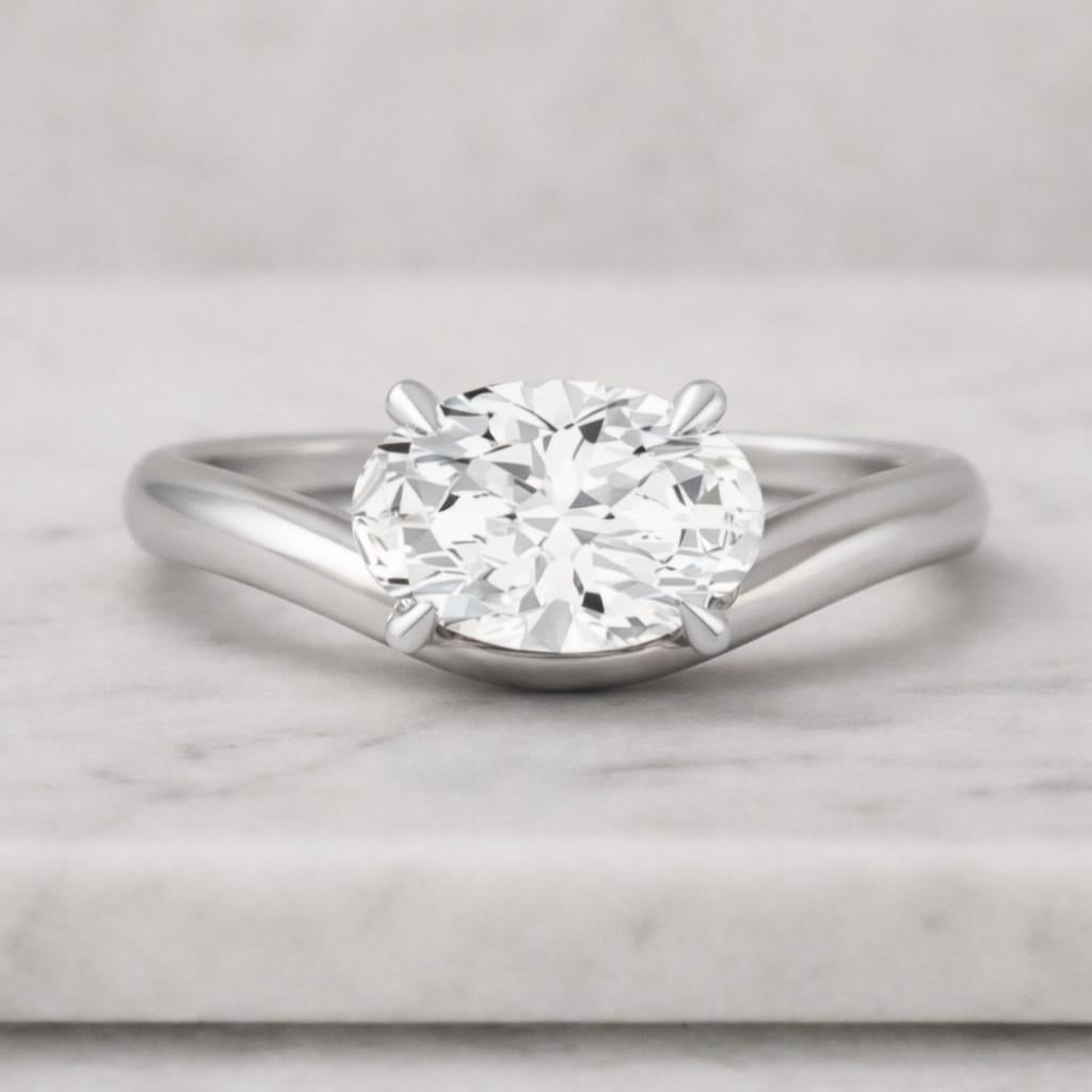 graduated oval and round diamond engagement ring