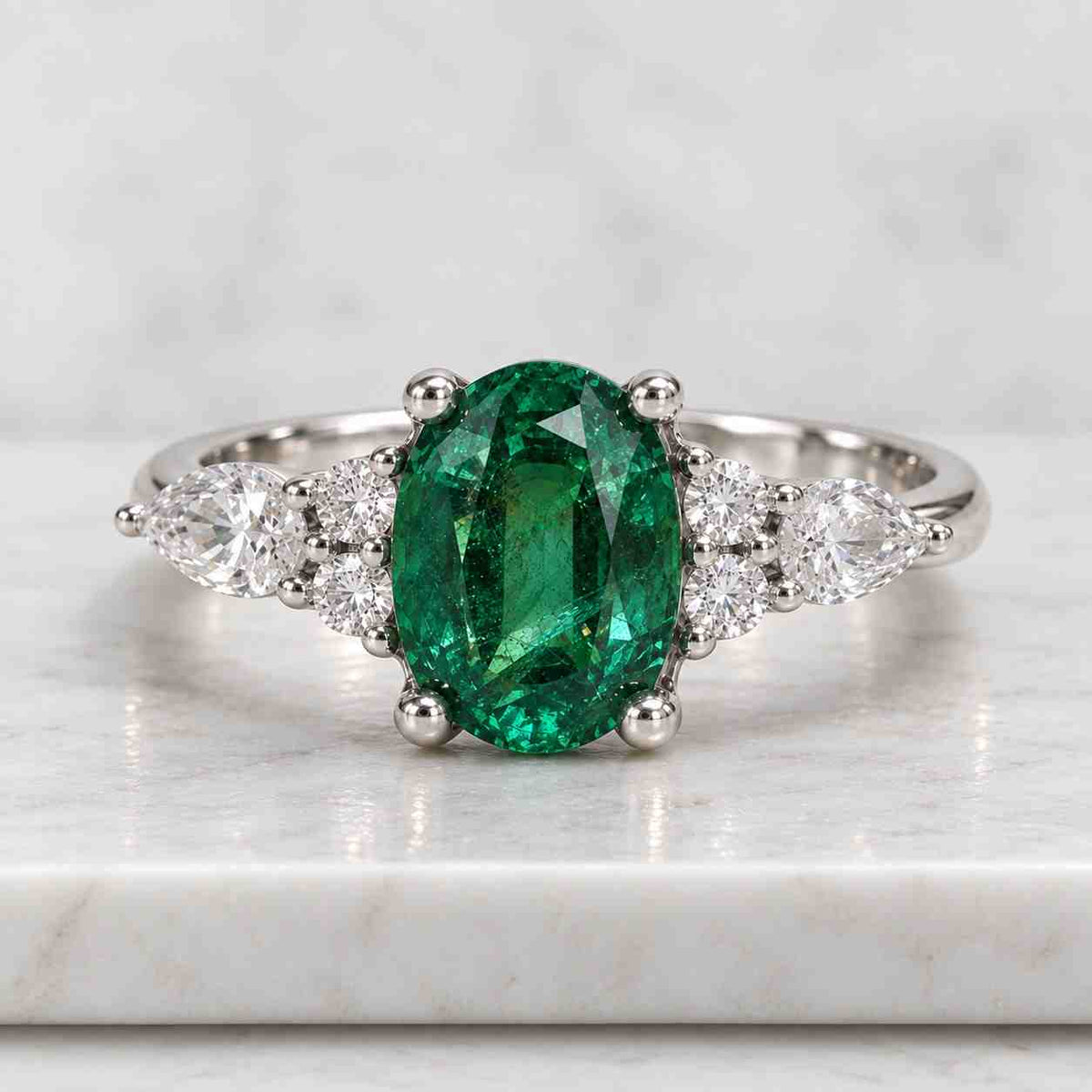oval lab grown diamond engagement ring: 14k gold three stone emerald accents