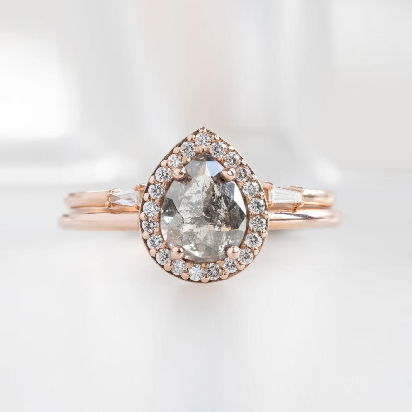 Pear shape salt and pepper diamond ring