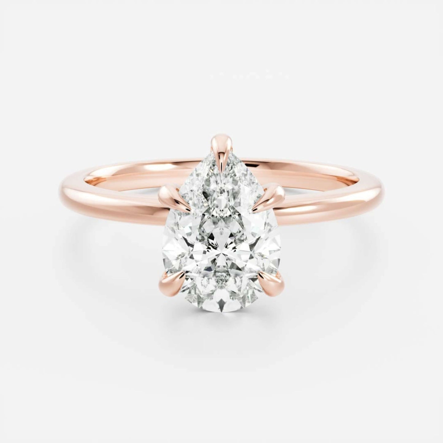 Rose Gold Pear Cut Diamond Basket Style Ring