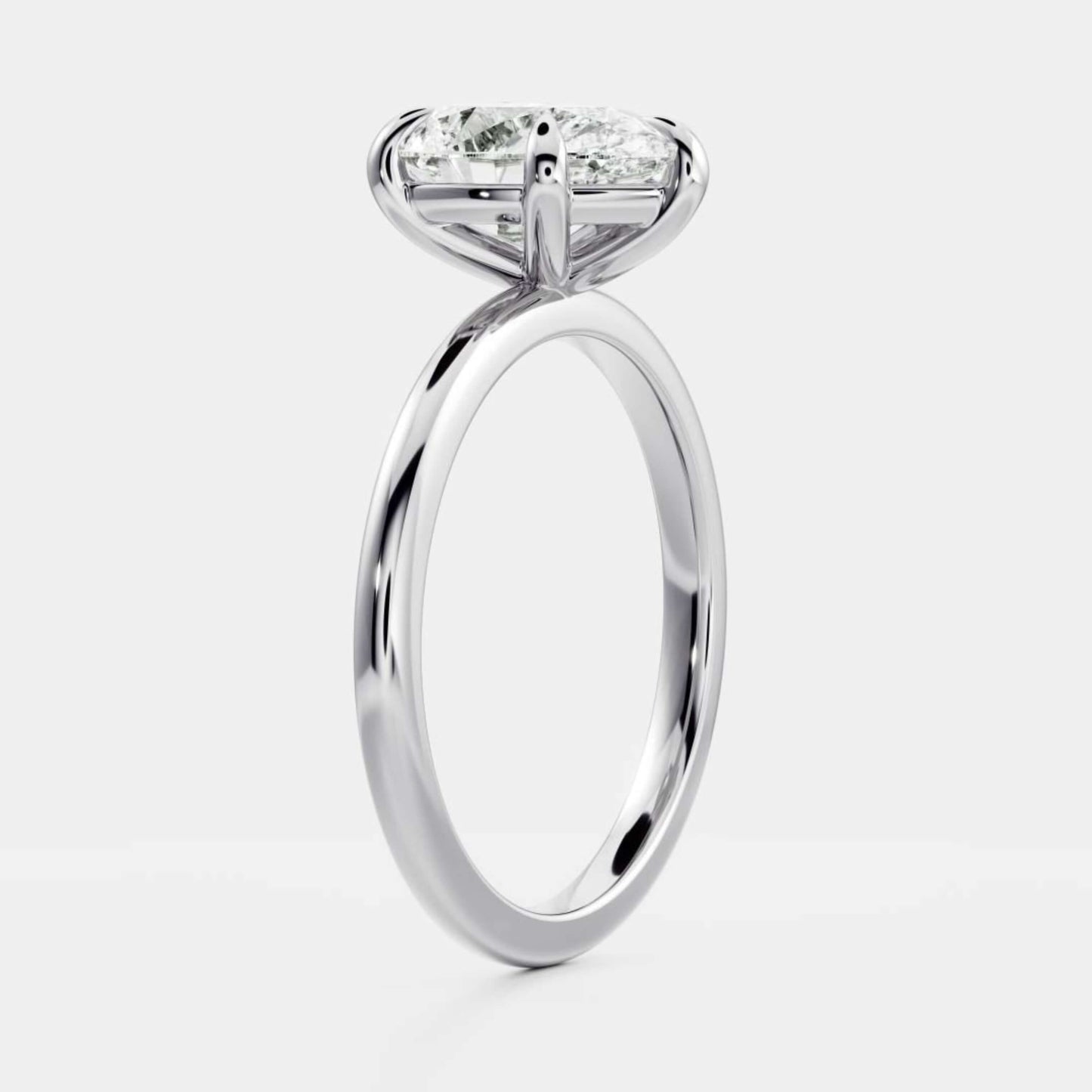 White Gold Pear Cut Diamond Basket Style Ring