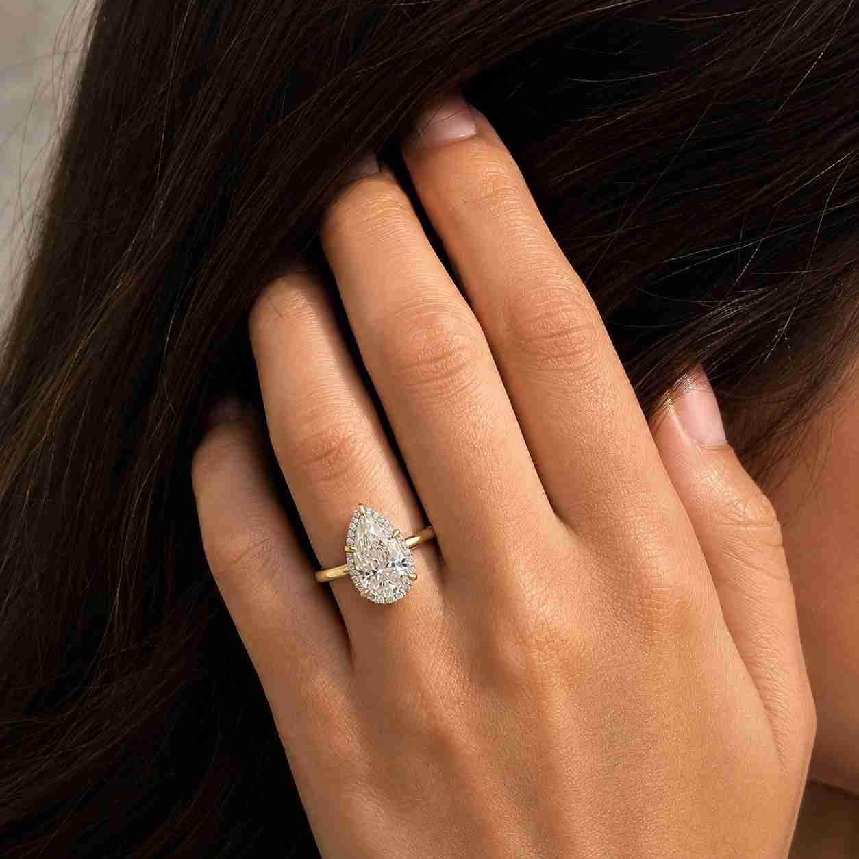 1.5 carat pear cut lab grown diamond engagement ring • hidden halo pave band
