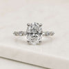 Oval Cut Lab Grown Diamond Engagement Ring with Round Accent Stones