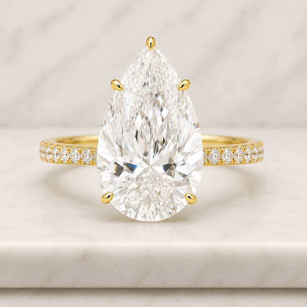 2 carat pear cut lab grown diamond ring: 14k yellow gold hidden halo
