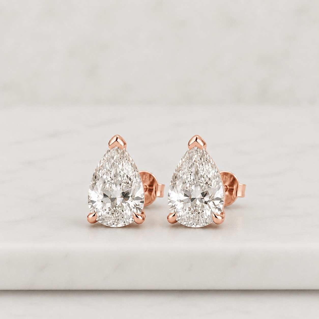 3.0 carat pear cut lab diamond earrings: gold plated sterling silver

