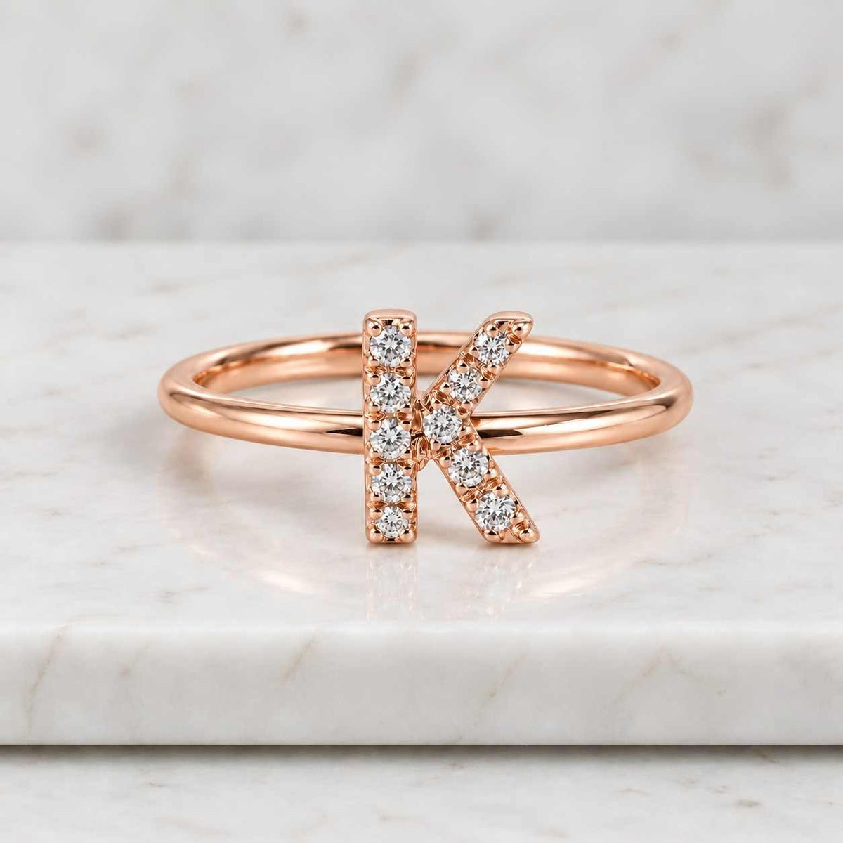 3.22 ct lab grown diamond k initial ring, yellow gold bezel setting, custom alphabet
