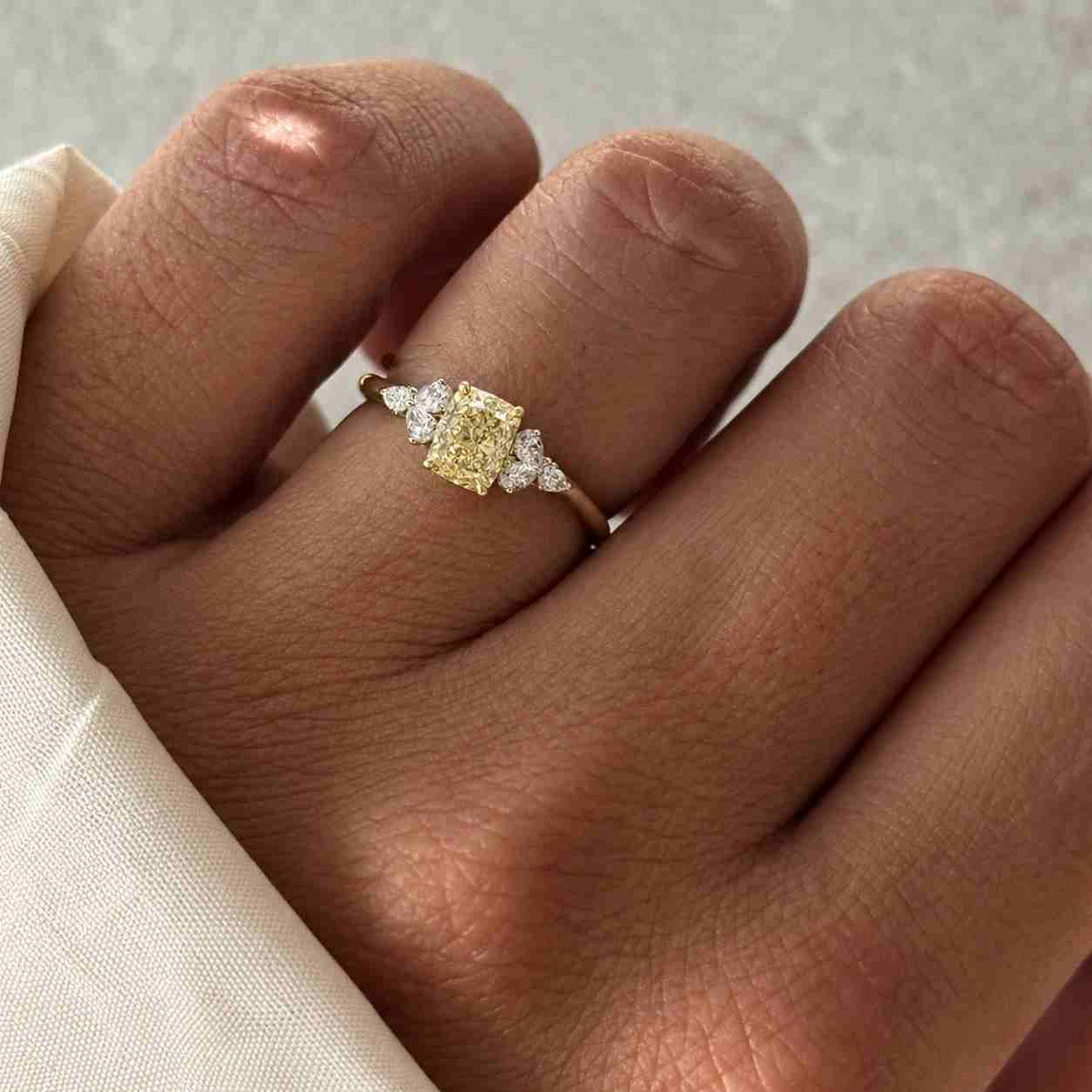 3.45ct fancy intense yellow cushion diamond lab grown three stone engagement ring | igi certified

