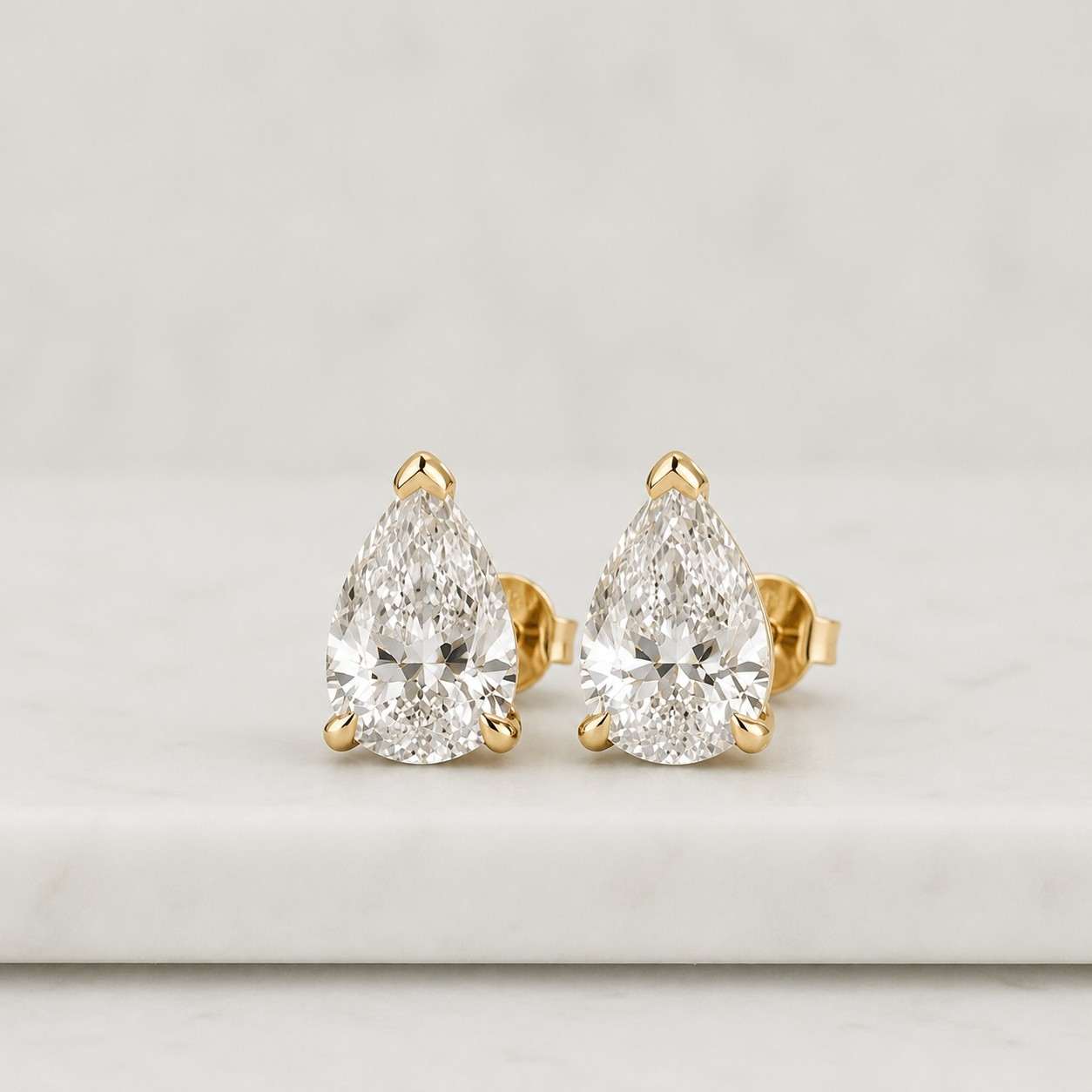 4.0 carat pear cut lab diamond earrings: 18k gold plated sterling silver
