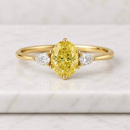 4.10 Carat Fancy Vivid Yellow VVS2 Clarity IGI Certified Oval Cut Lab Grown Diamond Three Stone Engagement Ring Side Pears 14k White Gold