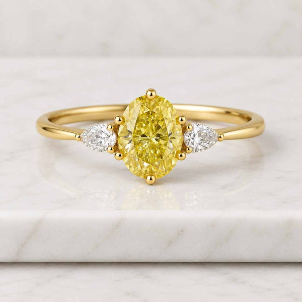4.10 Carat Fancy Vivid Yellow VVS2 Clarity IGI Certified Oval Cut Lab Grown Diamond Three Stone Engagement Ring Side Pears 14k White Gold