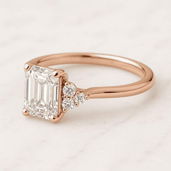 6.2 carat IGI Certified E Color VVS2 Clarity Emerald Cut Lab Grown Diamond Engagement Ring Side Trapezoid and Round Diamonds 18k Yellow Gold