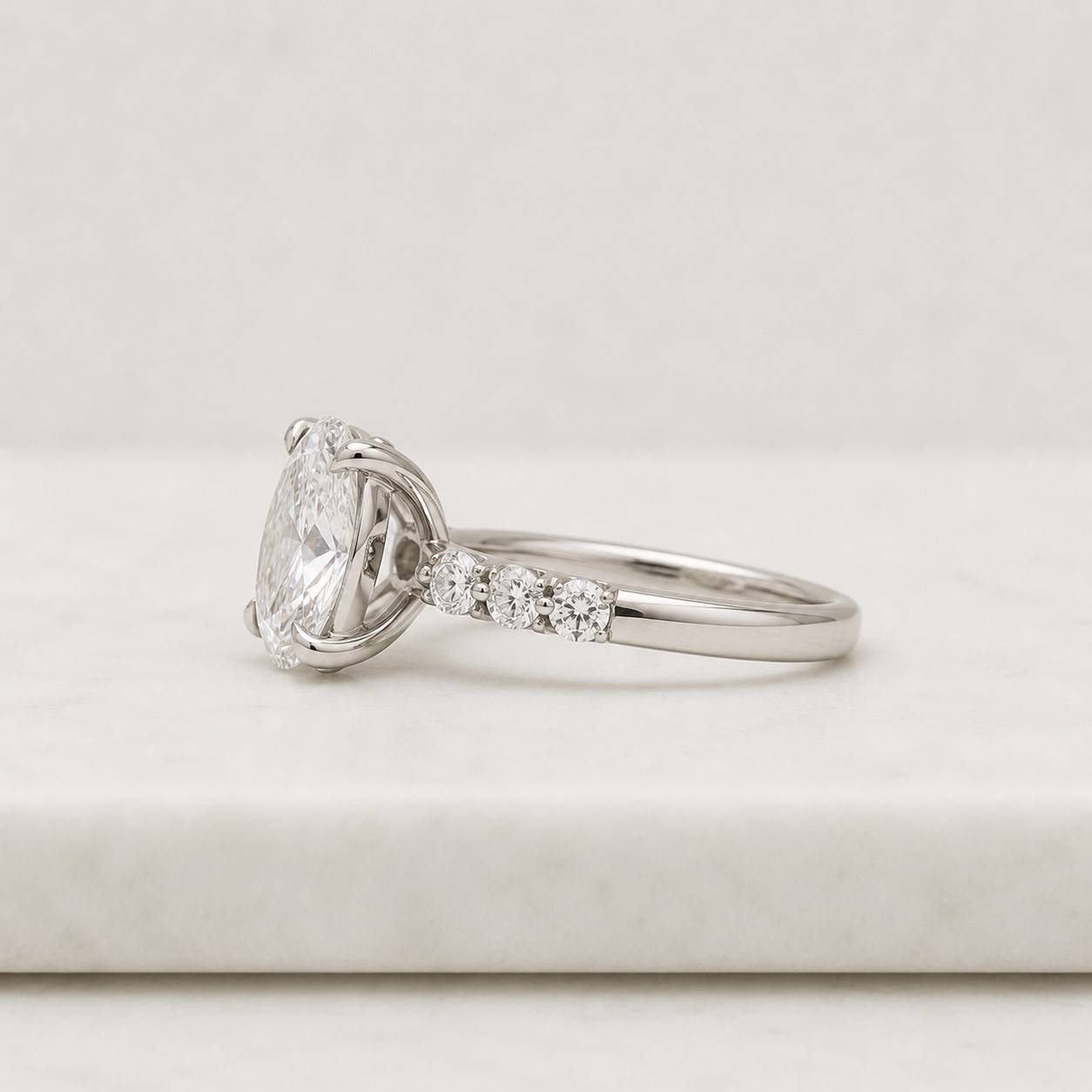 oval cut lab grown diamond pavé engagement ring in 14k white gold