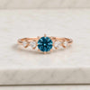 Round Cut Blue Sapphire Ring with Diamond Side Stones in Yellow Gold