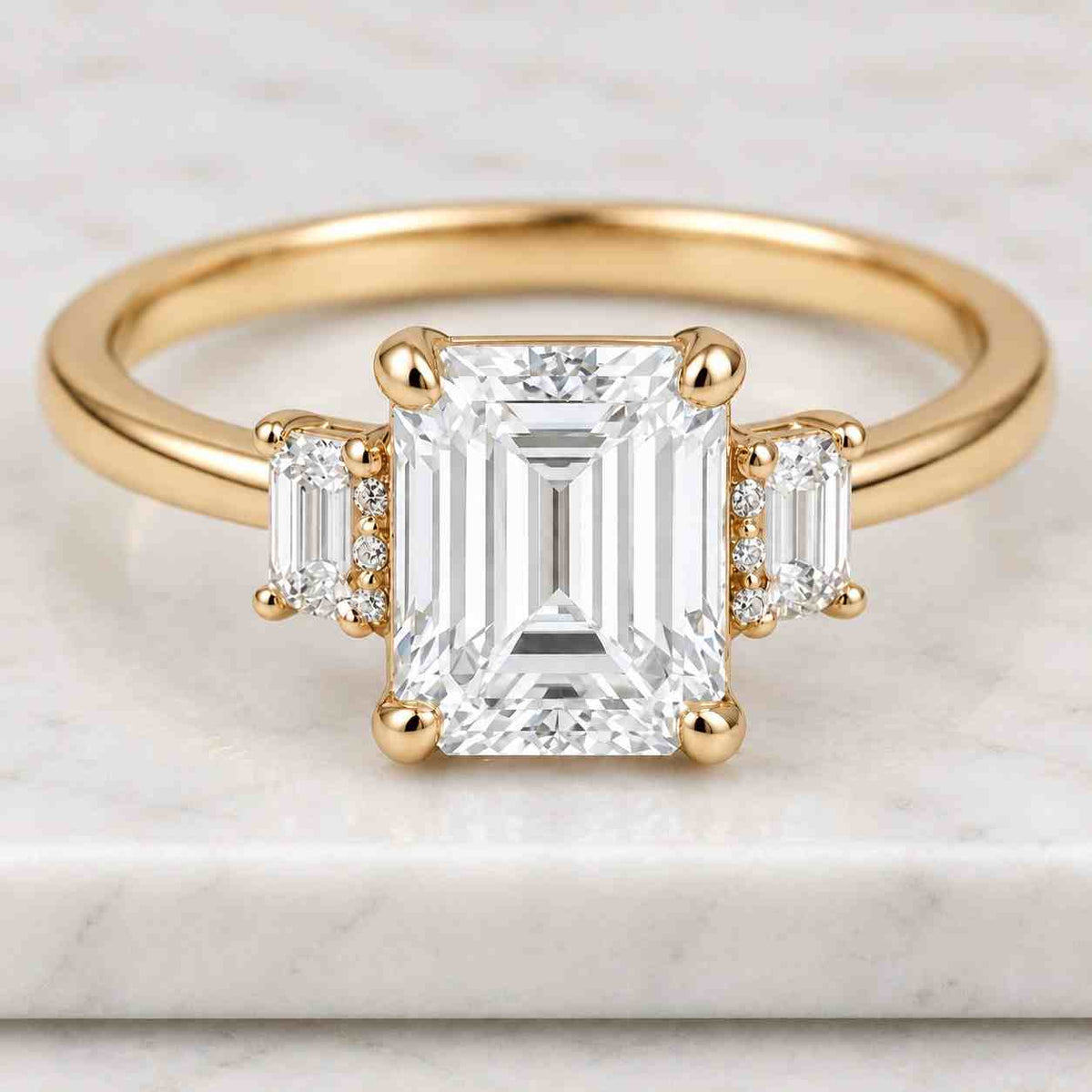 emerald cut lab diamond engagement ring, tapered baguettes, 14k yellow gold