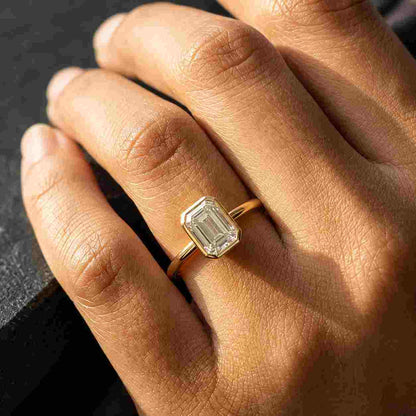 Emerald cut lab grown diamond ring with 10K gold bezel setting