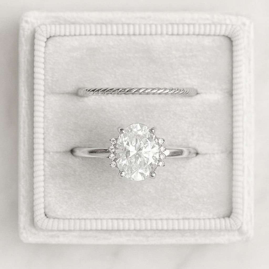 oval solitaire diamond engagement ring with pavé band by sami jewels