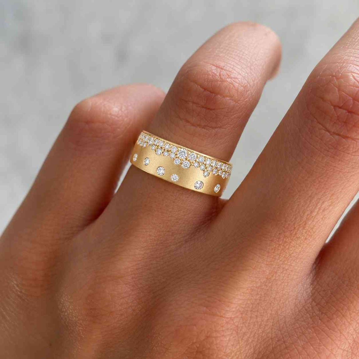 full eternity flush set diamond band, round cut moissanite wedding band, scattered diamond wide cigar band, 14k rose gold matte finish band
