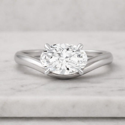 Graduated Oval and Round Diamond Engagement Ring