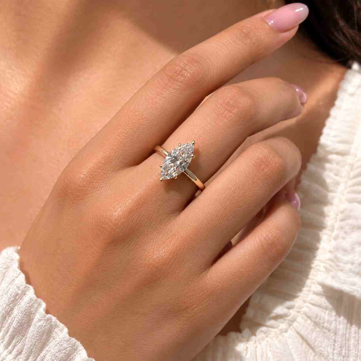 marquise cut diamond engagement ring with six claw prong setting