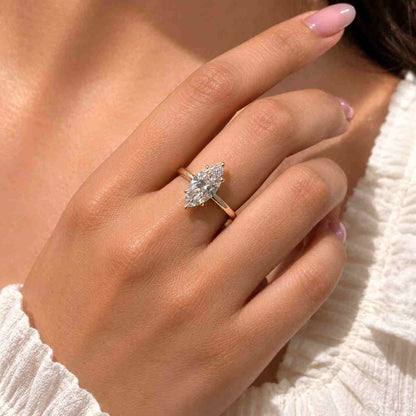 Marquise cut diamond engagement ring with six claw prong setting