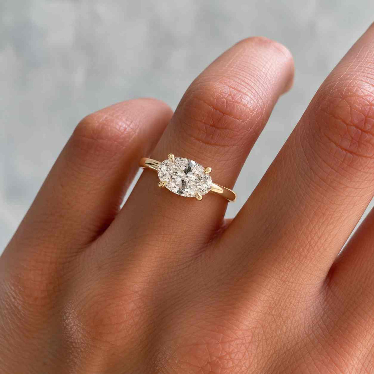 oval cut moissanite solitaire engagement ring in 14k yellow gold
