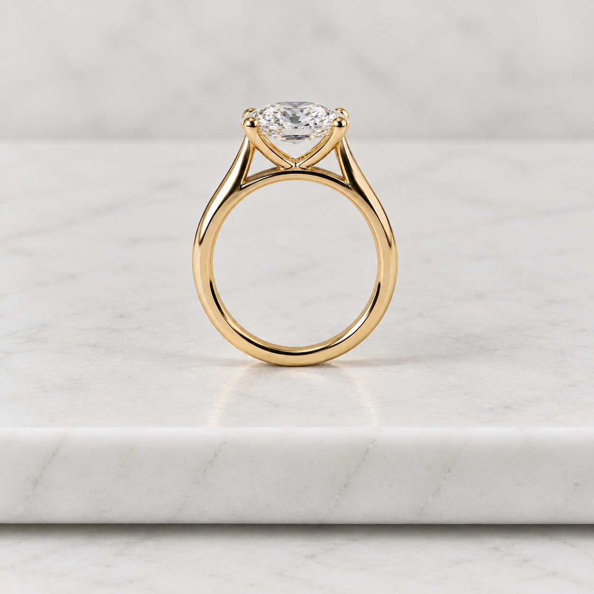 oval cut moissanite solitaire engagement ring in 14k yellow gold