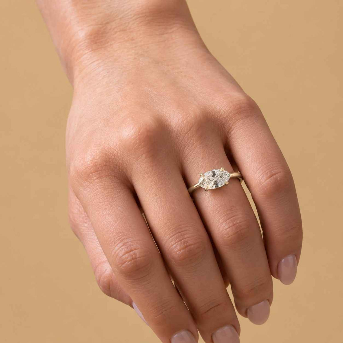 oval cut moissanite solitaire engagement ring in 14k yellow gold