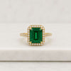 Emerald Cut Emerald Halo Ring with Round Diamond Accents