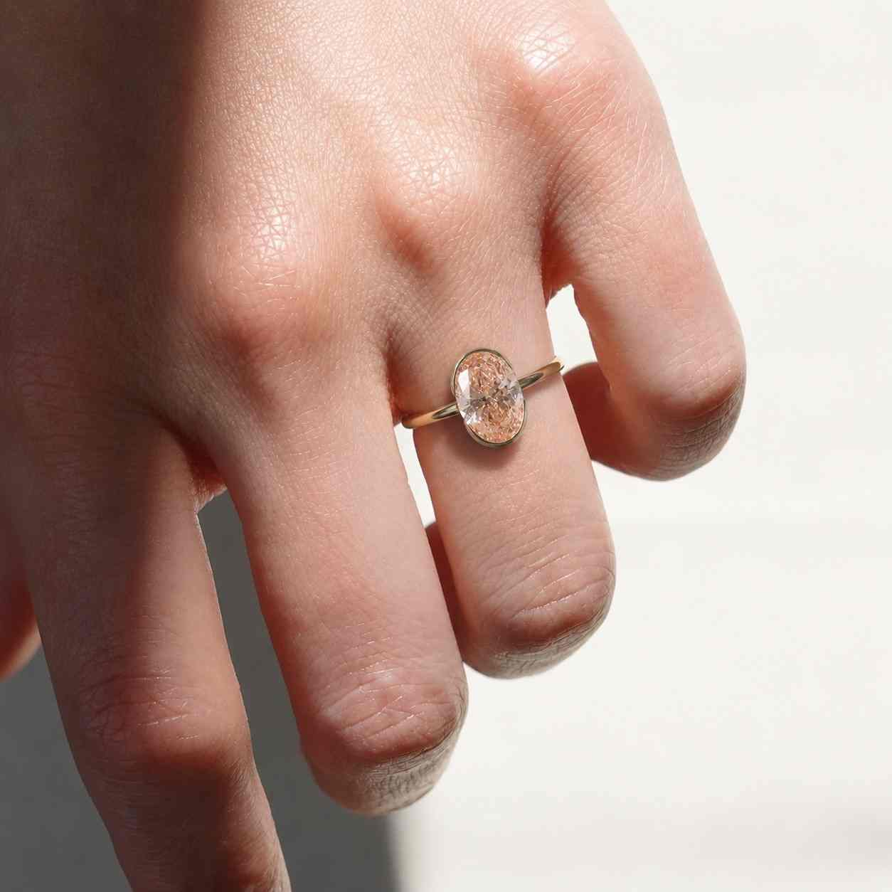 oval lab grown diamond engagement ring: half bezel, 10k/14k/18k gold
