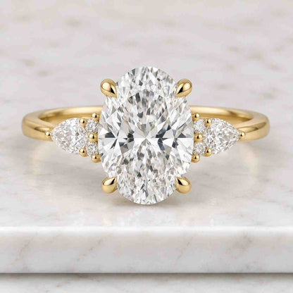 Oval Lab Grown Diamond Three Stone Engagement Ring, Pear Side Stones, IGI Certified 14K Yellow Gold, D-F Color VVS-VS1, Handmade New York