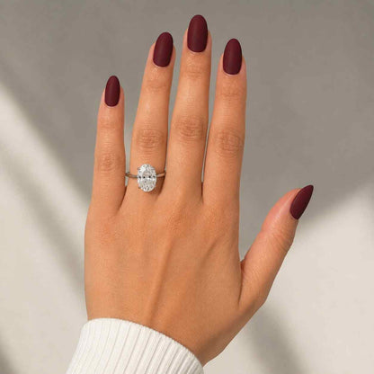 Oval Shaped Brilliant Cut Diamond Solitaire Engagement Ring on Hand