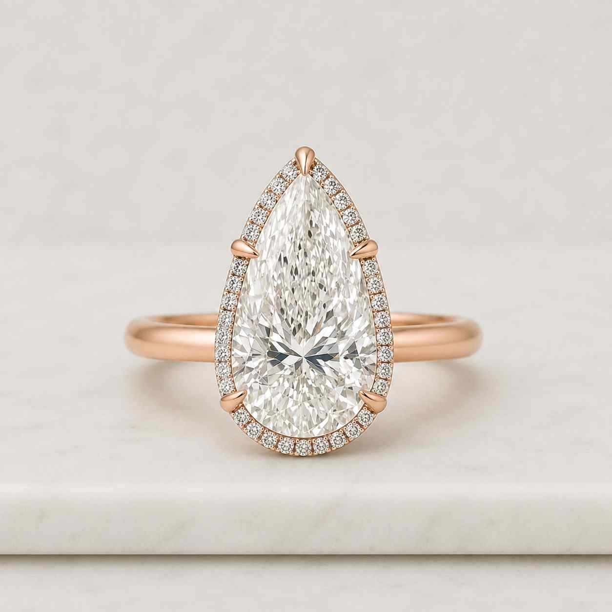 pear cut hidden halo engagement ring, tapered band cathedral solitaire, 18k yellow gold, igi certified, d-f color vvs-vs1, handmade new york
