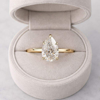 Pear Cut Solitaire cathedral ring in Titanium or White Gold
