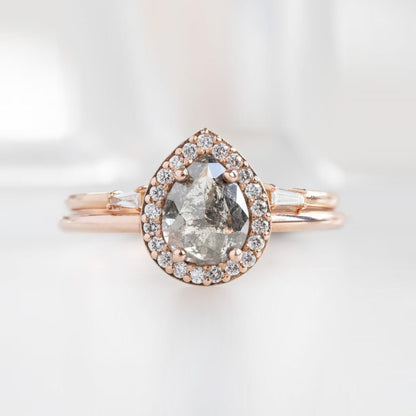 Pear shape salt and pepper diamond ring