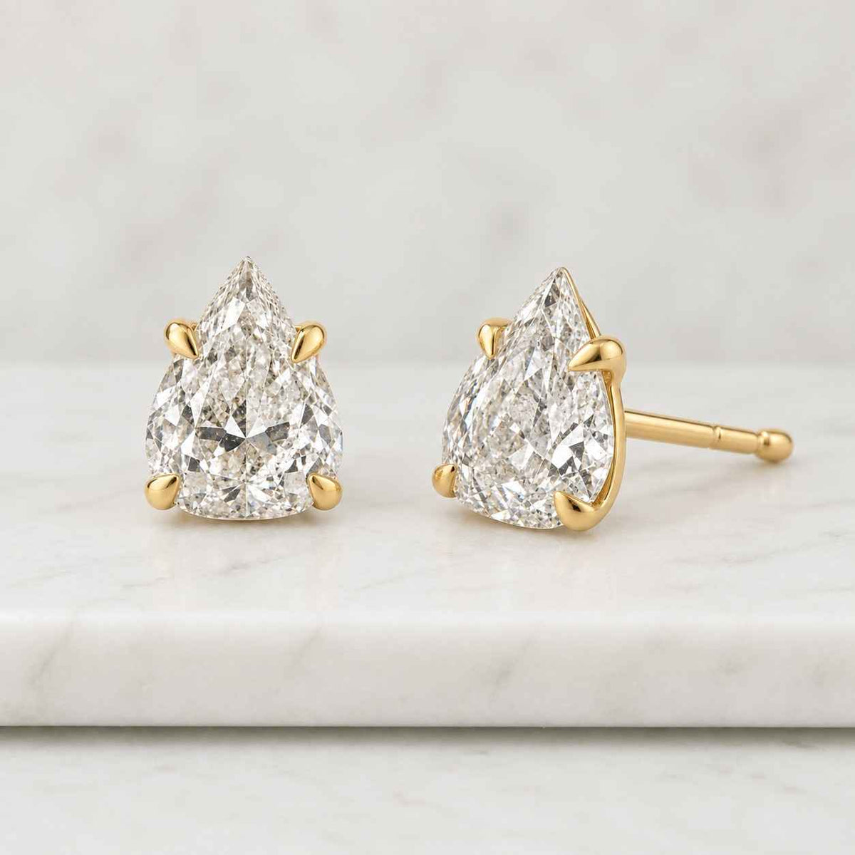 4 carat radiant cut lab grown diamond stud earrings: 14k yellow gold
