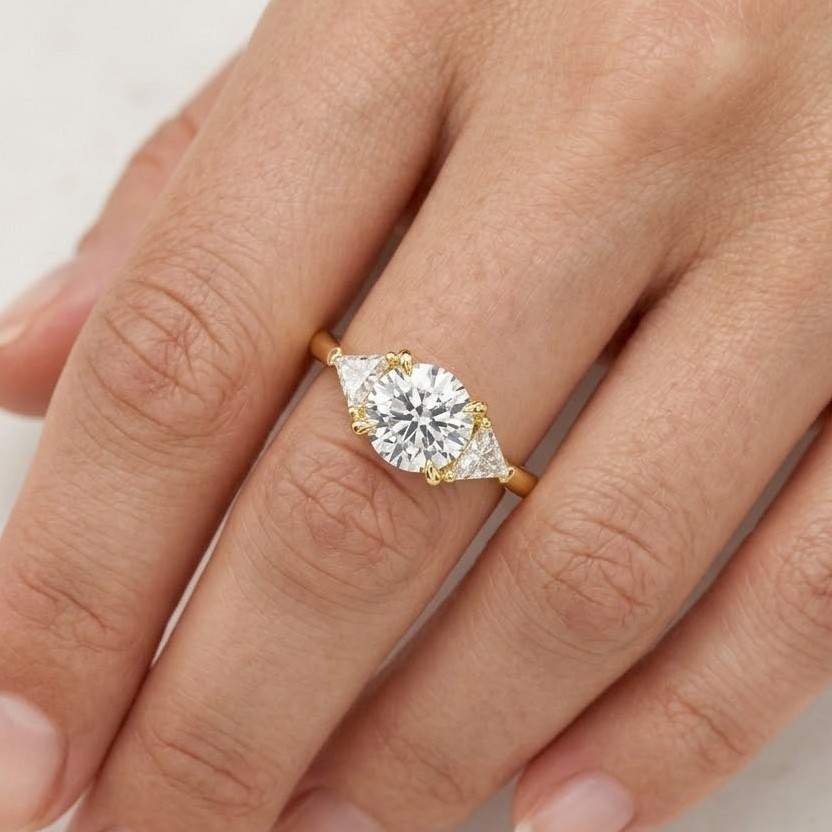 solid gold three stone round cut moissanite engagement ring with trillion accent, rs-ro-288
