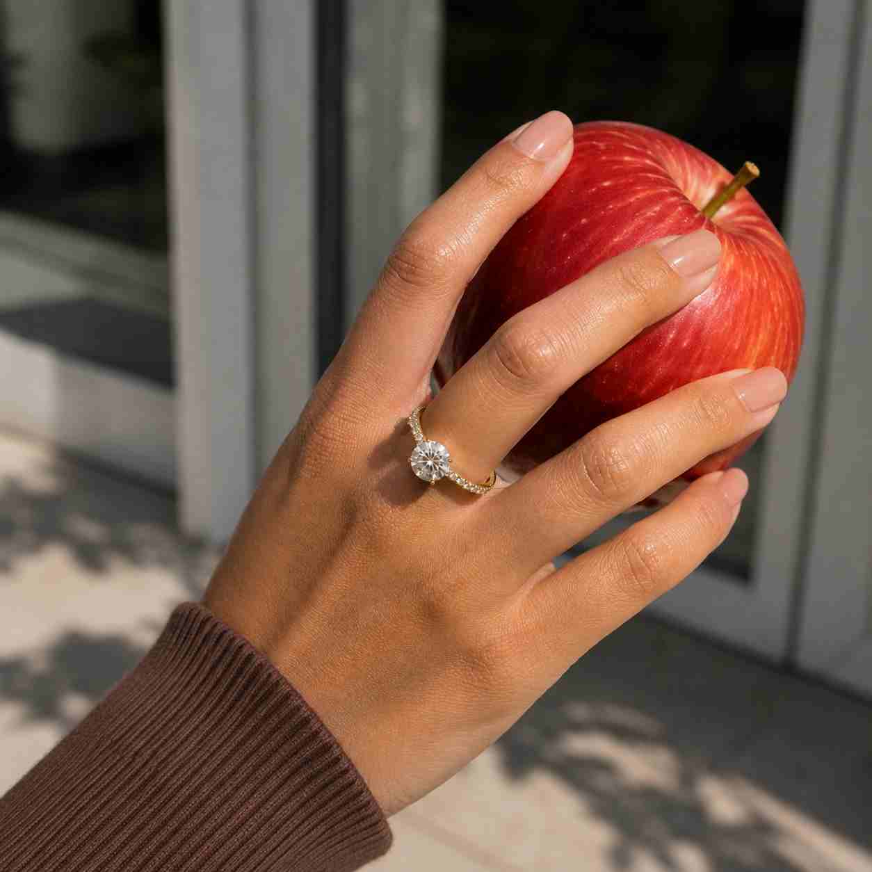 round cut diamond ring with gold pave band