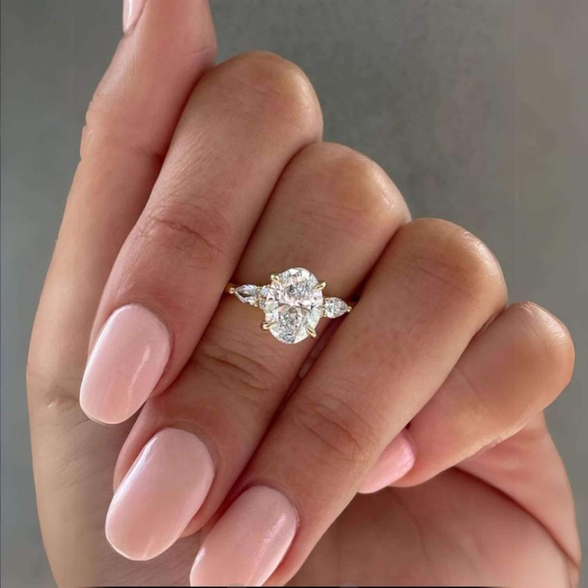 Side Pear Diamonds, 14k Gold
Three Stone Oval Moissanite Engagement Ring in 14k Solid Gold