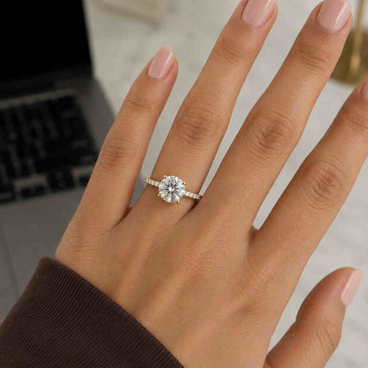 Simple round cut diamond engagement ring on finger