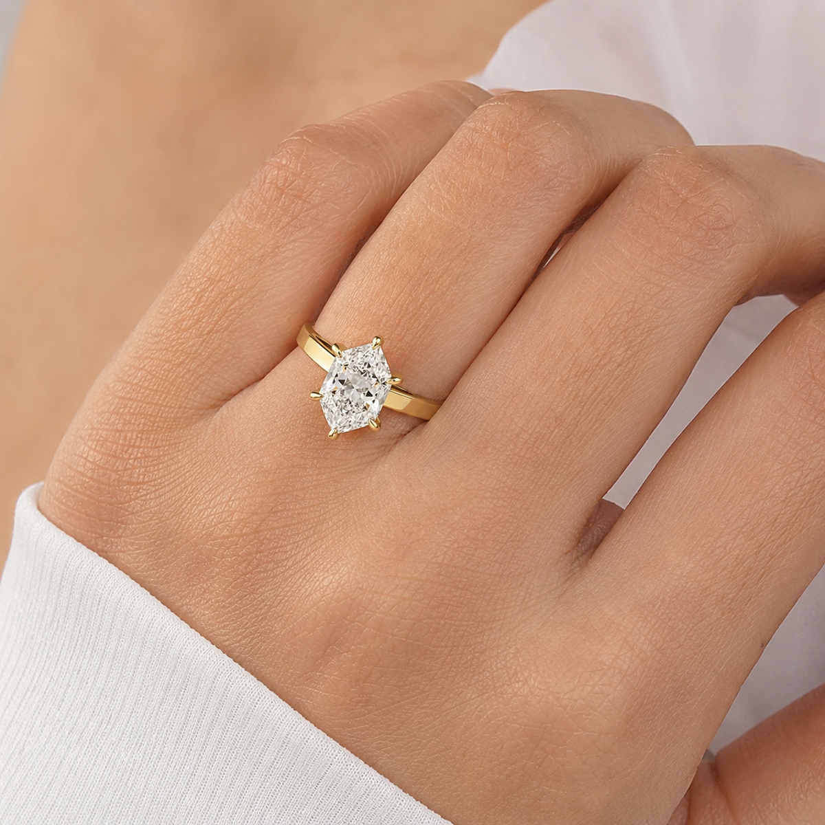 solid gold solitaire oval cut moissanite engagement ring east west set
