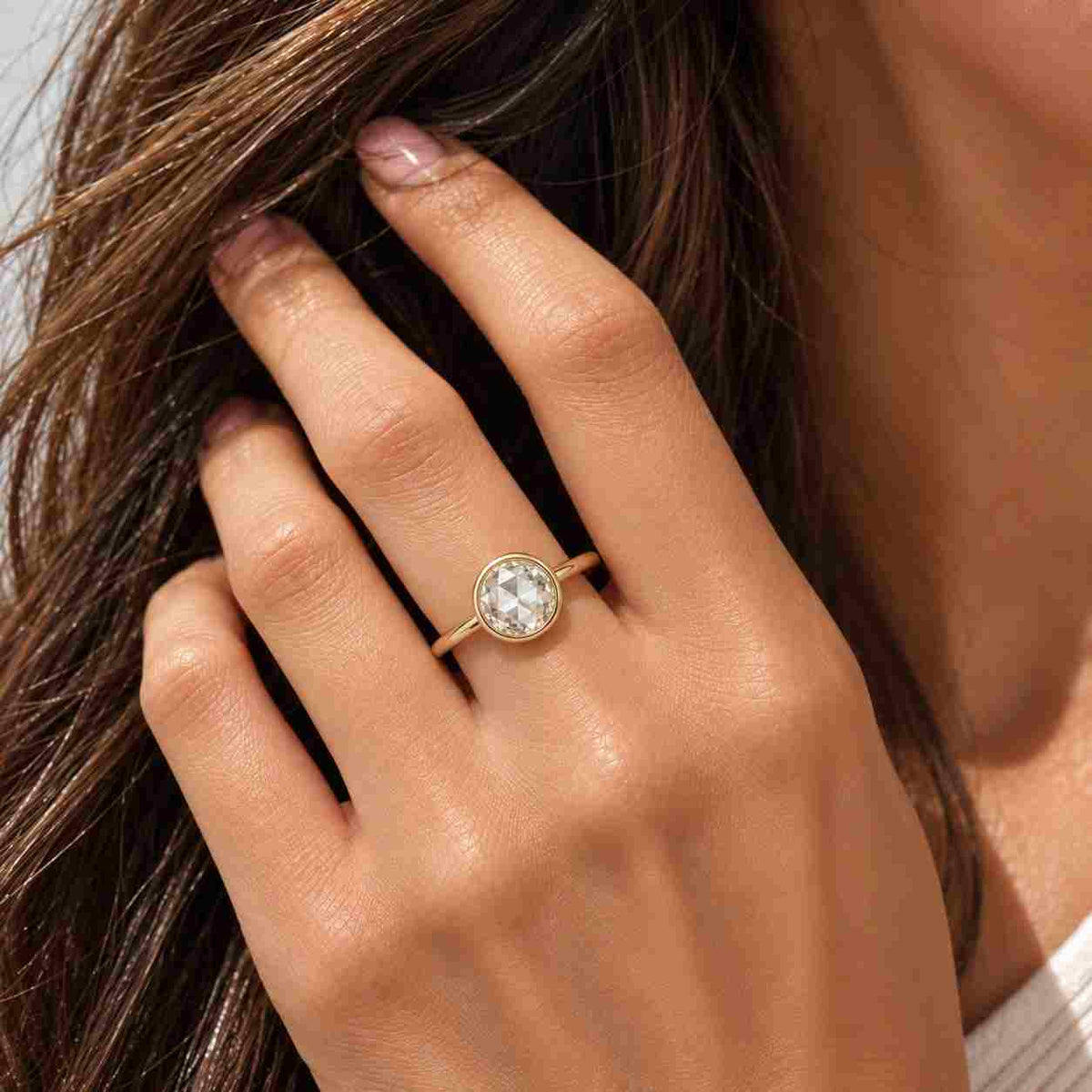 solid gold solitaire round cut moissanite engagement ring bezel set, cathedral ring