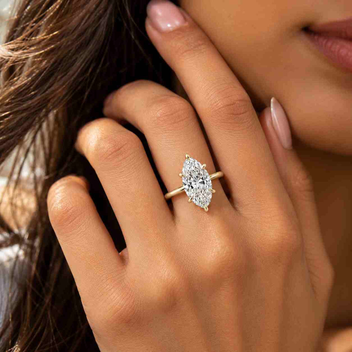 solid gold tulip set solitaire marquise cut moissanite engagement ring cathedral set