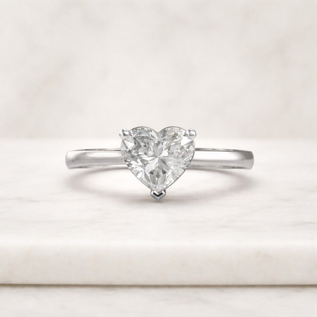 The solitaire setting highlights the shape and brilliance of the heart cut diamond while keeping the overall design minimal and easy to style.