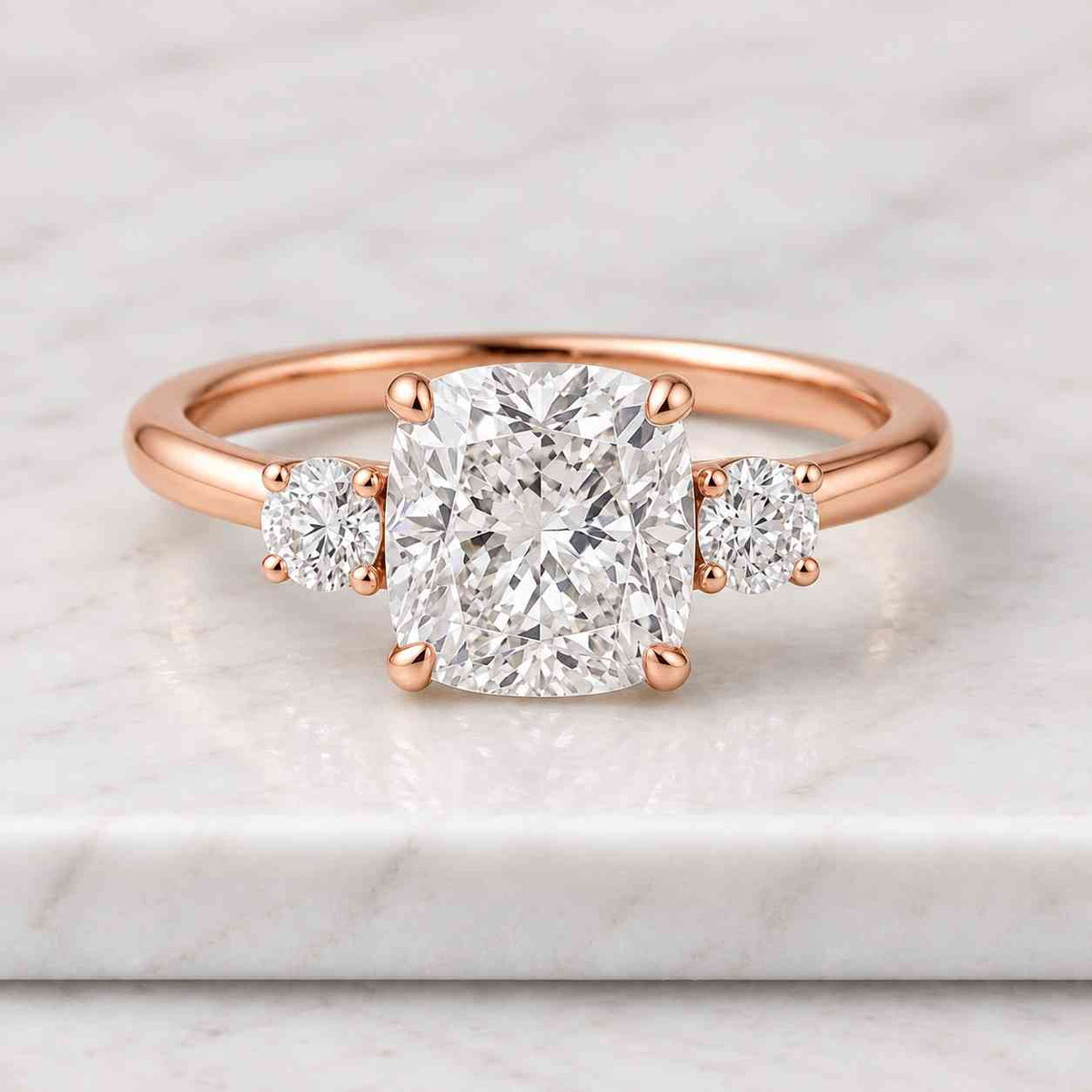 three stone cushion cut engagement ring with side trillion