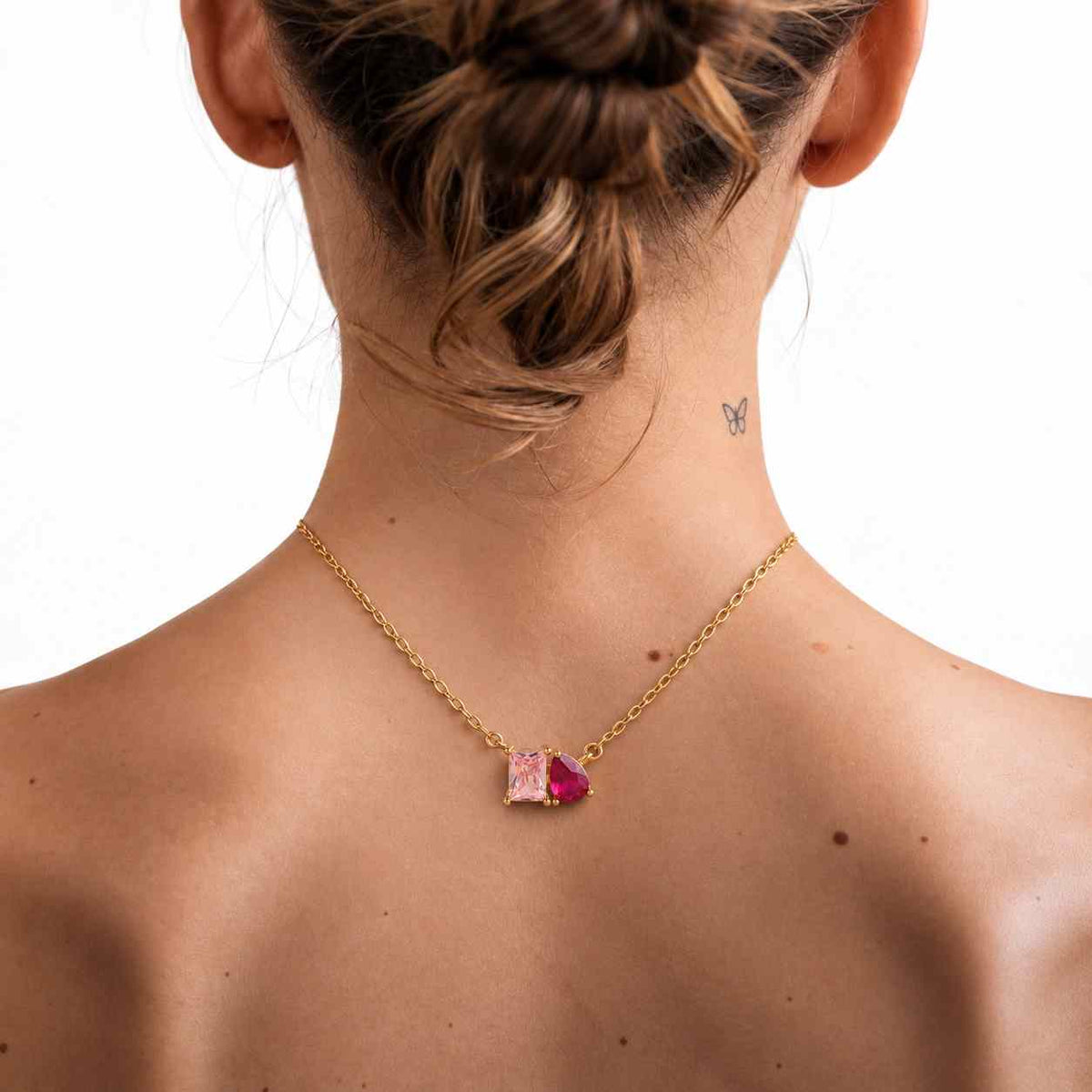 toi et moi emerald and pear cut moissanite solid rose gold prong set pendant
