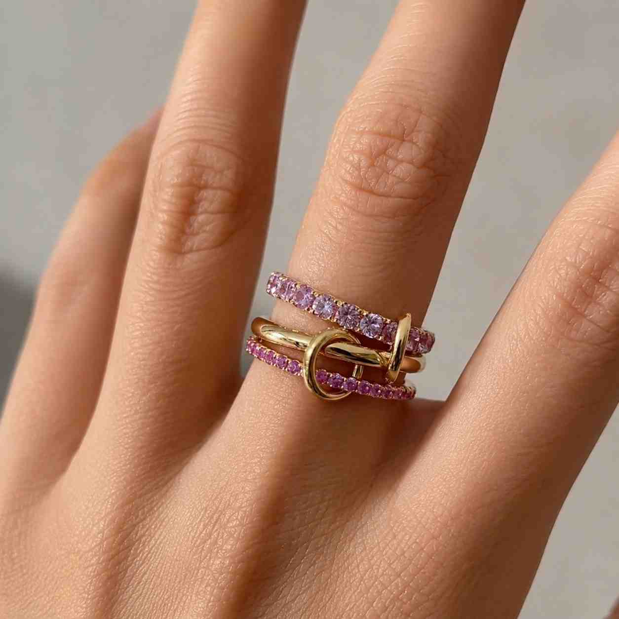 triple link stacking ring, pink sapphire interlocking link loop ring, buckle style gold wrap ring, minimalist stacking linked band ring