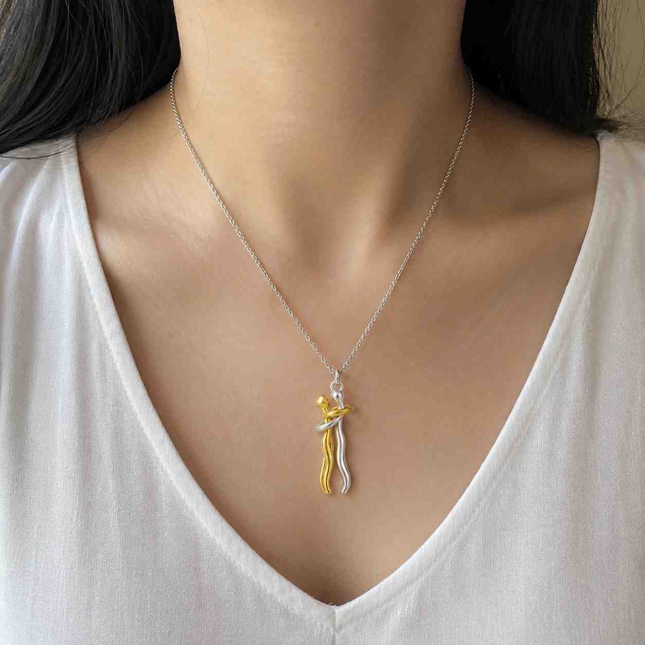 twisted embrace pendant necklace by feel amara • mixed metal lovers pendant • waterproof gold & silver • hypoallergenic • gift for her