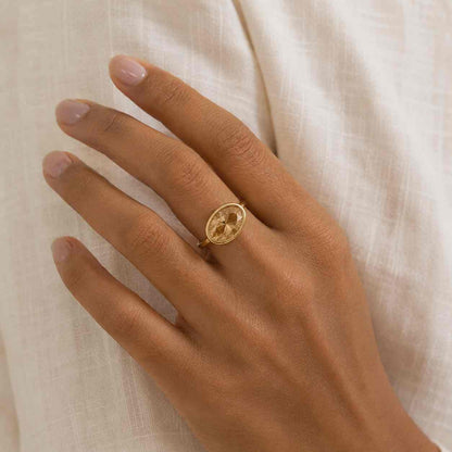 Yellow gold oval diamond ring with bezel setting for women