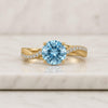 Round Cut Aquamarine Gemstone and Diamond Twist Engagement Ring